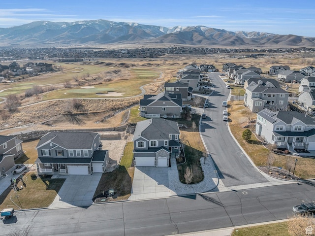 birds eye view of property with a mountain view