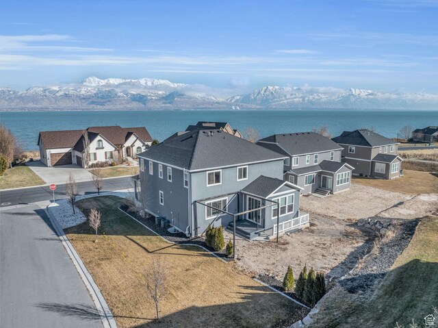 bird's eye view with a water and mountain view