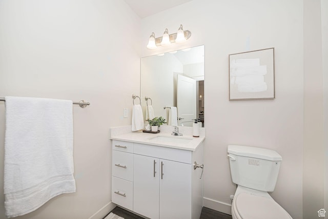 bathroom with toilet and vanity