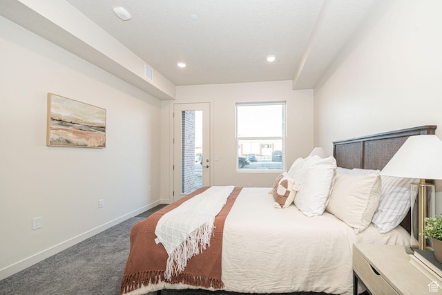 bedroom with carpet flooring and access to outside