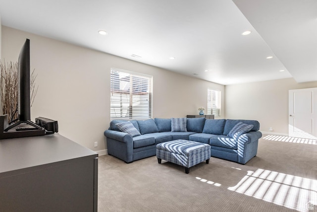 living room with light carpet, recessed lighting, and a healthy amount of sunlight