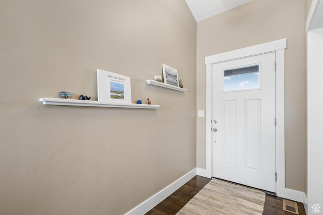 entrance foyer with baseboards, dark wood-type flooring, and visible vents