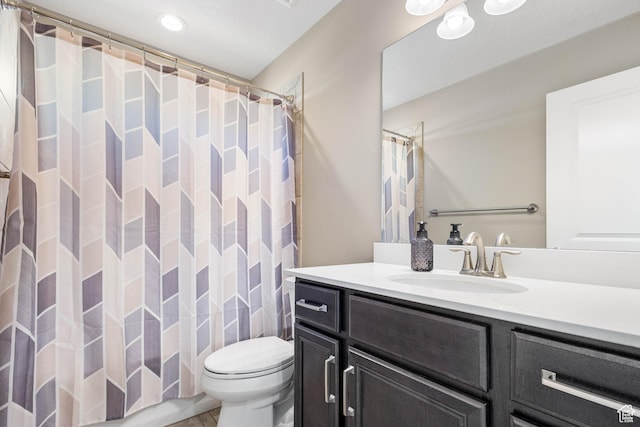 full bath featuring vanity, curtained shower, and toilet