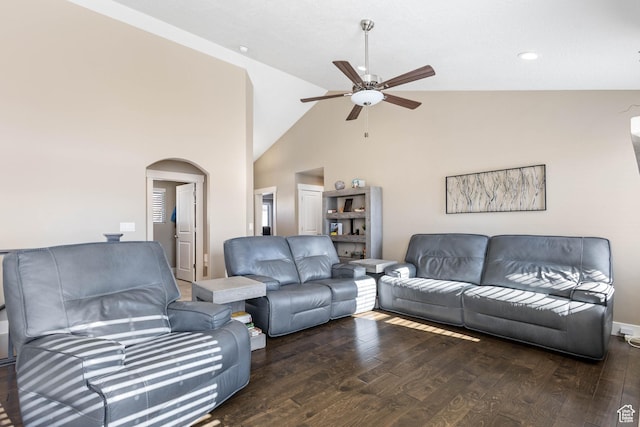 living room featuring arched walkways, a ceiling fan, and wood finished floors