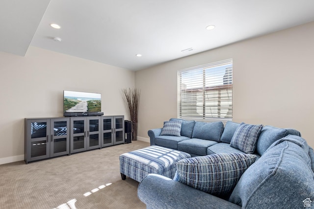 living room featuring baseboards, carpet flooring, and recessed lighting