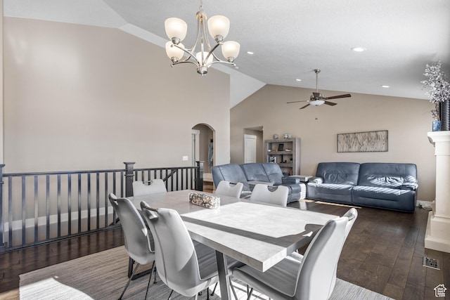 dining area with recessed lighting, lofted ceiling, arched walkways, wood-type flooring, and ceiling fan with notable chandelier