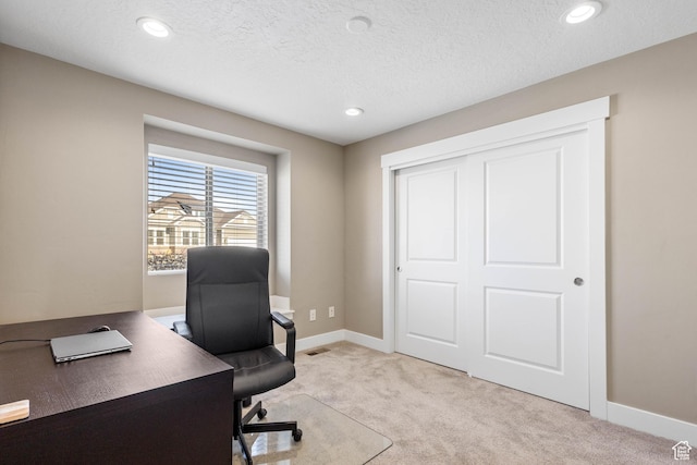 office area featuring light carpet, baseboards, and recessed lighting