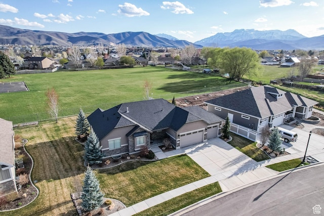 birds eye view of property with a mountain view and a residential view