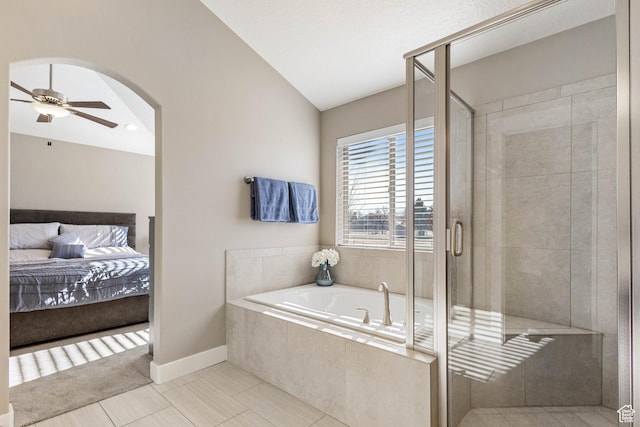 ensuite bathroom featuring a shower stall, ceiling fan, a bath, and ensuite bathroom