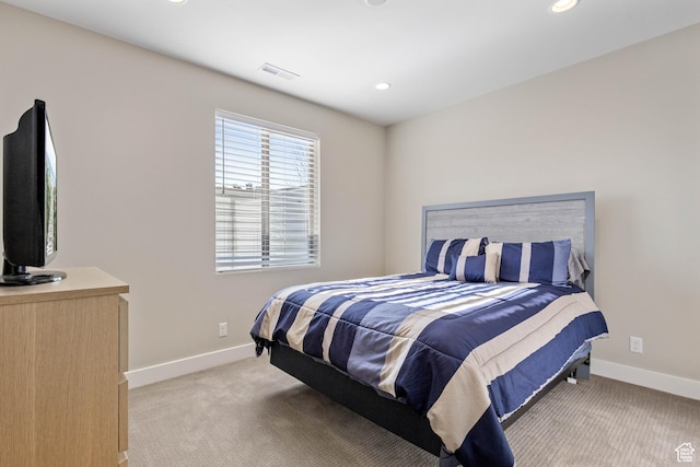bedroom featuring light colored carpet, baseboards, and recessed lighting