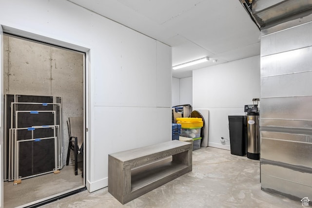 interior space featuring unfinished concrete floors