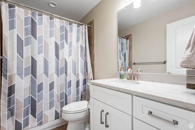 full bathroom featuring vanity and toilet