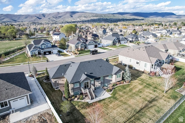 drone / aerial view with a residential view and a mountain view