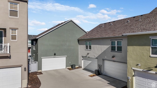 6671 W Skip Rock Rd, South Jordan, UT 84009 - view of side of home featuring central AC unit and a garage