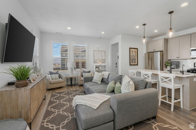6671 W Skip Rock Rd, South Jordan, UT 84009 - living room featuring dark wood-type flooring and sink