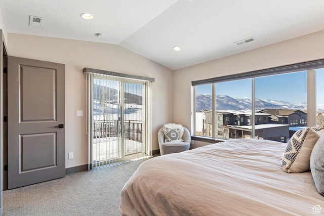 bedroom featuring a mountain view, visible vents, access to exterior, and vaulted ceiling