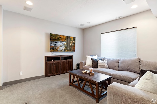 living area with light colored carpet, baseboards, visible vents, and recessed lighting