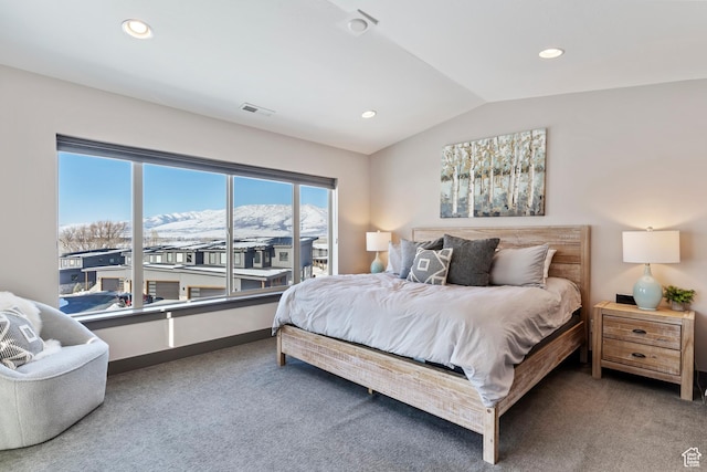 carpeted bedroom with visible vents, recessed lighting, and vaulted ceiling