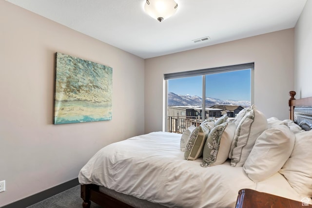 carpeted bedroom featuring access to outside and visible vents