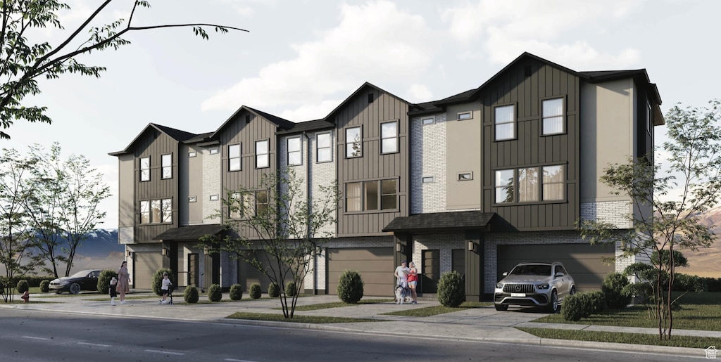townhome / multi-family property featuring a garage