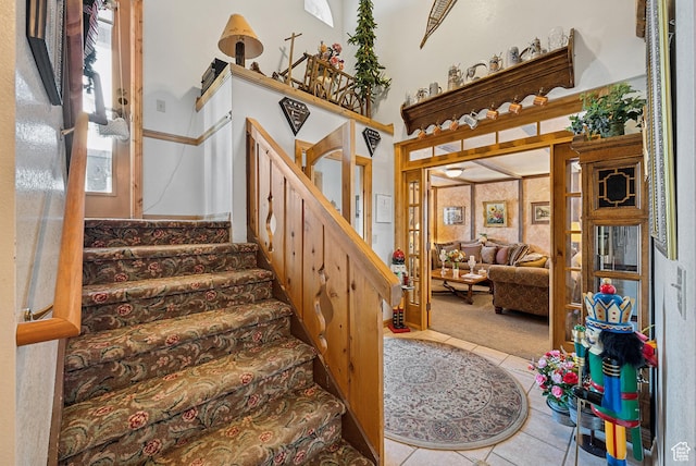stairway featuring tile patterned floors