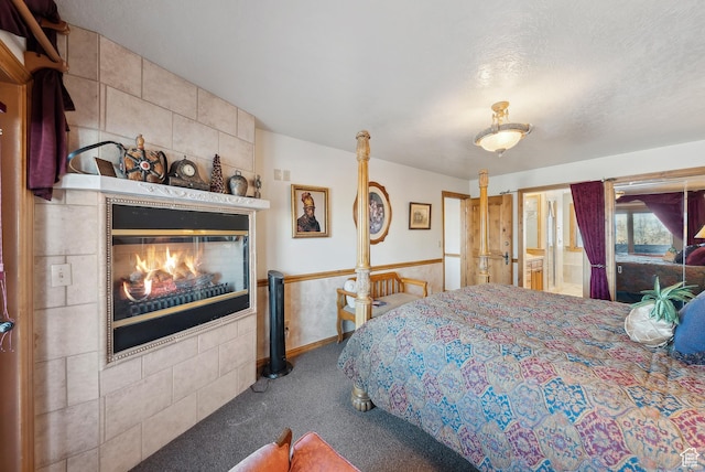 bedroom featuring carpet floors and a fireplace