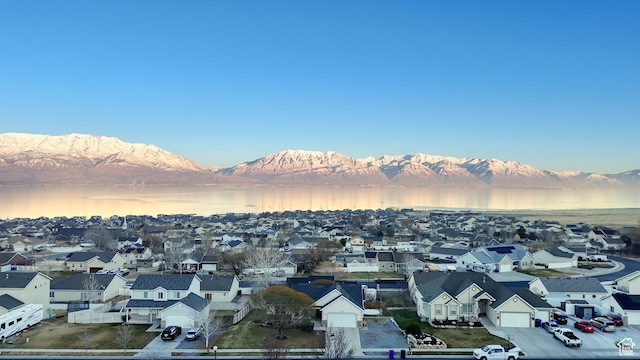 exterior space with a water and mountain view