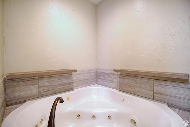 bathroom with tiled tub