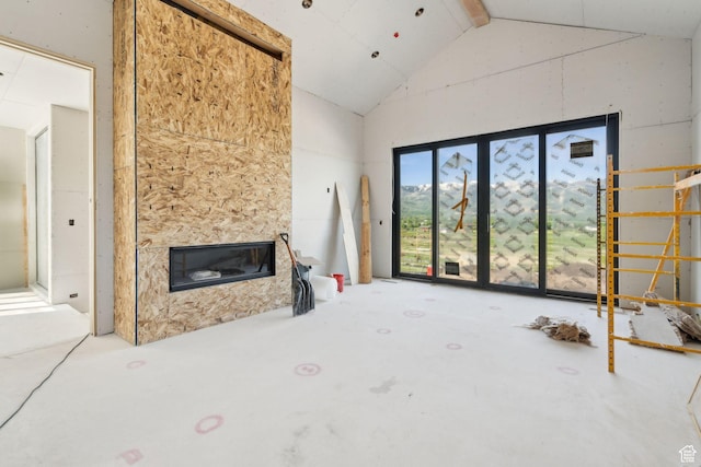 5220 N Old Ranch Rd, Park City, UT 84098 - unfurnished living room featuring high vaulted ceiling and a glass covered fireplace