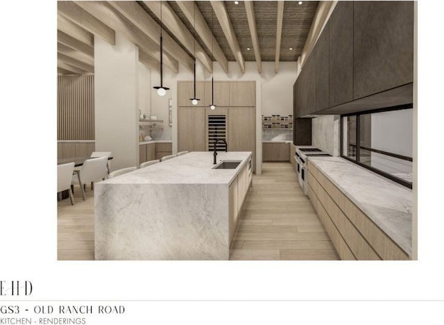 5220 N Old Ranch Rd, Park City, UT 84098 - kitchen featuring modern cabinets, double oven range, light wood finished floors, a center island with sink, and light stone countertops