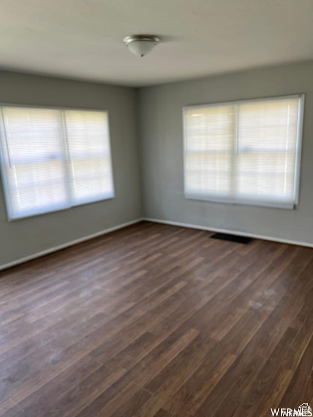 2802 Adams Ave, Ogden, UT 84403 - spare room featuring dark hardwood / wood-style flooring and a wealth of natural light