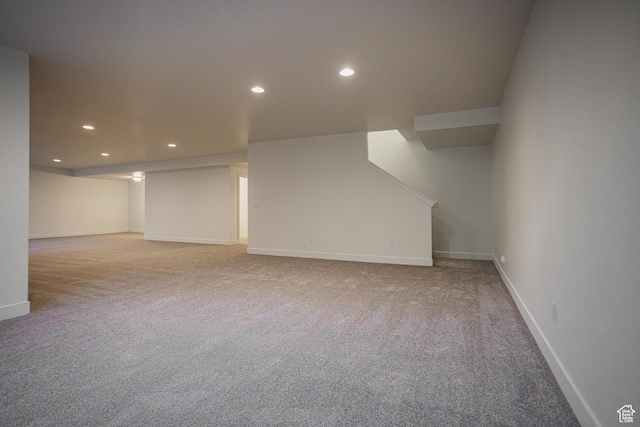 finished below grade area with recessed lighting, carpet flooring, and baseboards