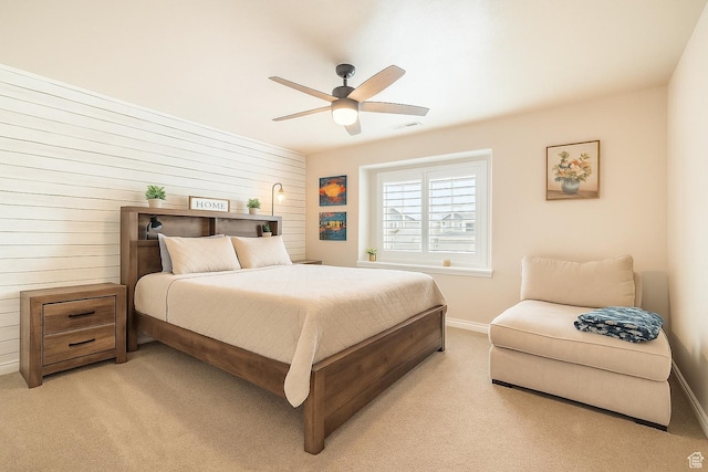 1841 E Whitetail Dr, Layton, UT 84040 - bedroom featuring light carpet, baseboards, wood walls, and a ceiling fan