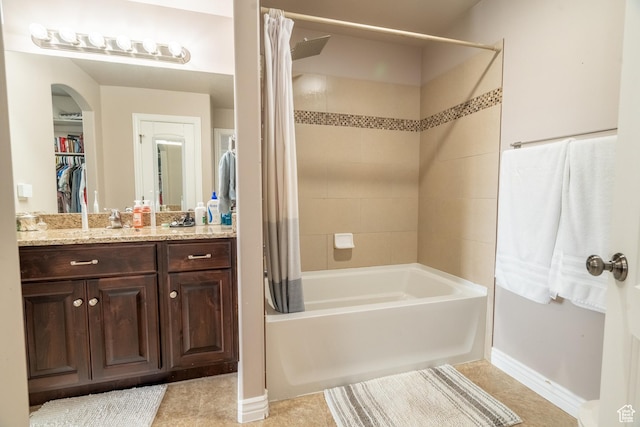 1841 E Whitetail Dr, Layton, UT 84040 - full bathroom with shower / tub combo with curtain, vanity, baseboards, and tile patterned floors