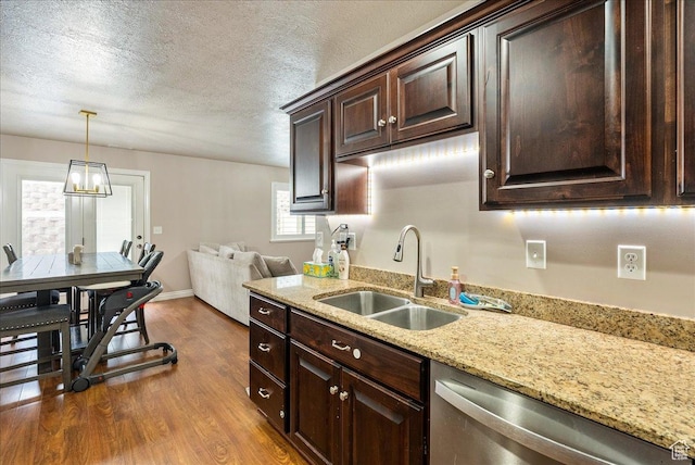 1841 E Whitetail Dr, Layton, UT 84040 - kitchen featuring stainless steel dishwasher, dark wood-type flooring, dark brown cabinets, hanging light fixtures, and a textured ceiling