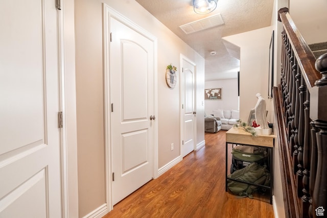 1841 E Whitetail Dr, Layton, UT 84040 - hallway featuring light wood-type flooring and baseboards
