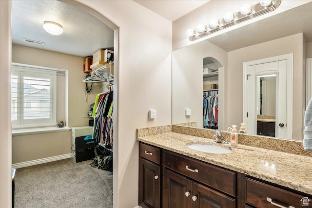 1841 E Whitetail Dr, Layton, UT 84040 - bathroom with vanity and a walk in closet
