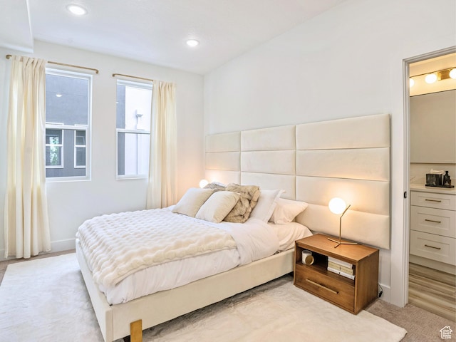 bedroom featuring recessed lighting