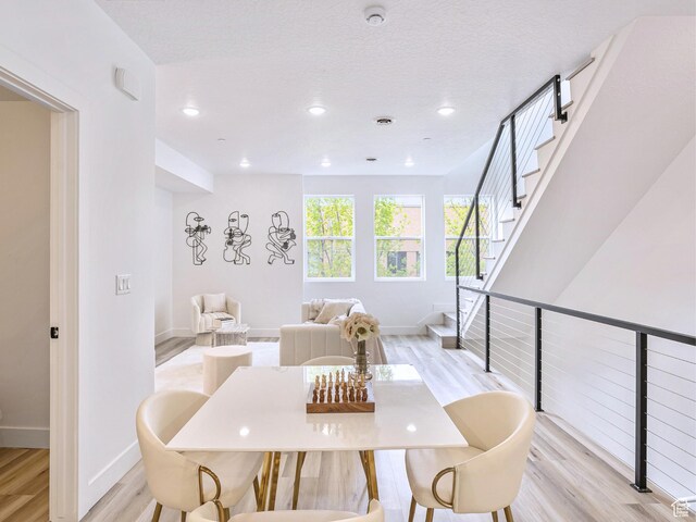dining space with recessed lighting, baseboards, and light wood-style floors