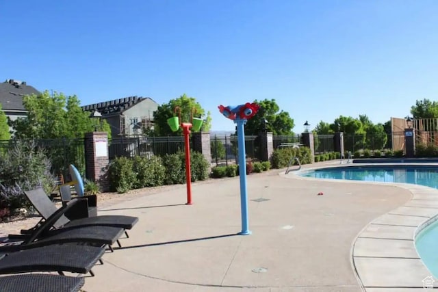 view of swimming pool with a patio area