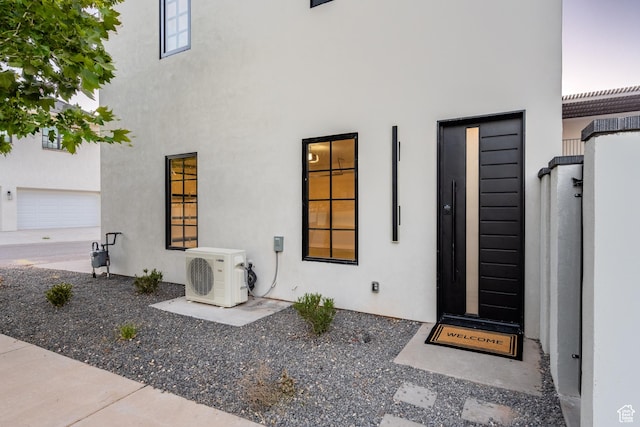 entrance to property featuring ac unit