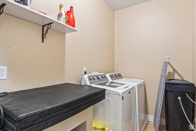 laundry area with independent washer and dryer