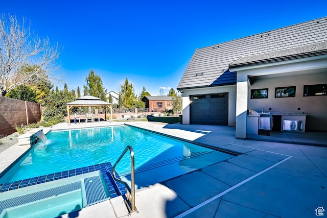 1283 N Gallen Rd W, Santa Clara, UT 84765 - view of swimming pool with pool water feature, a patio area, and a gazebo