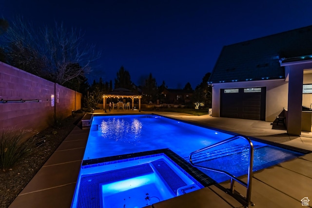 1283 N Gallen Rd W, Santa Clara, UT 84765 - pool at night with a patio area, an outbuilding, a gazebo, and an in ground hot tub
