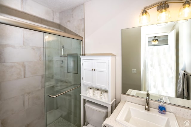 1283 N Gallen Rd W, Santa Clara, UT 84765 - bathroom featuring a shower with shower door, toilet, and vanity