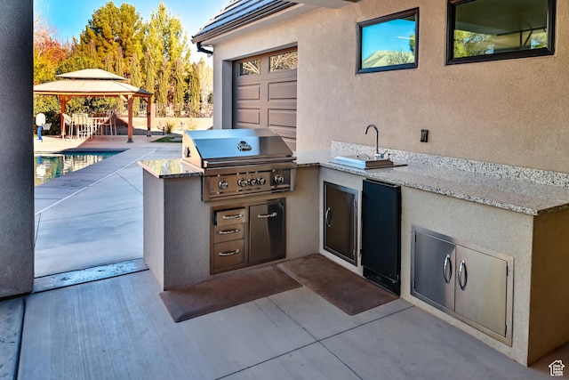 1283 N Gallen Rd W, Santa Clara, UT 84765 - view of patio featuring a gazebo, an outdoor kitchen, and area for grilling