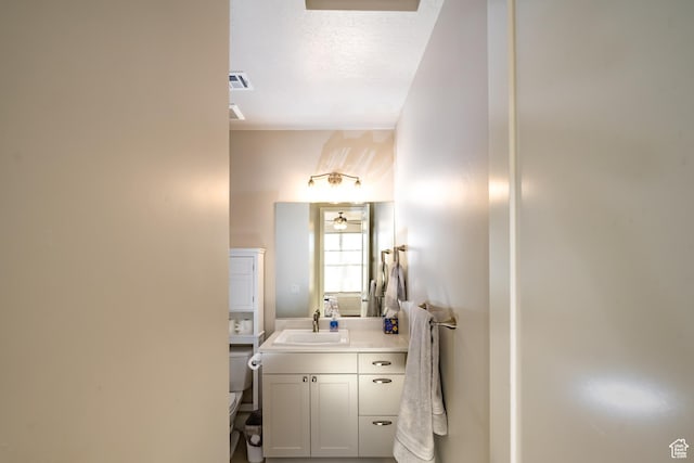 1283 N Gallen Rd W, Santa Clara, UT 84765 - bathroom featuring a textured ceiling, toilet, and vanity
