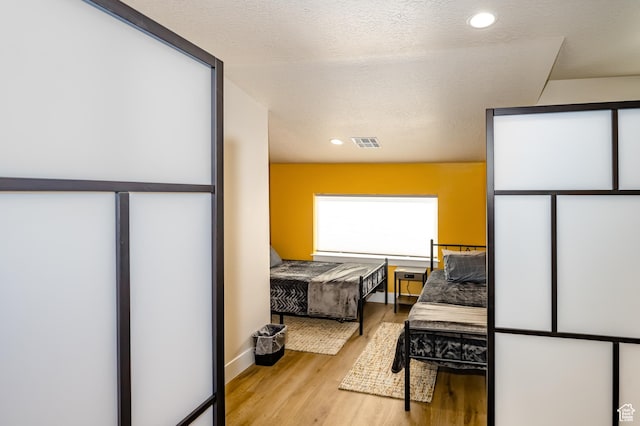 1283 N Gallen Rd W, Santa Clara, UT 84765 - bedroom with a textured ceiling and light hardwood / wood-style flooring