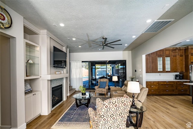 1283 N Gallen Rd W, Santa Clara, UT 84765 - living room featuring ceiling fan, a textured ceiling, and light wood-type flooring