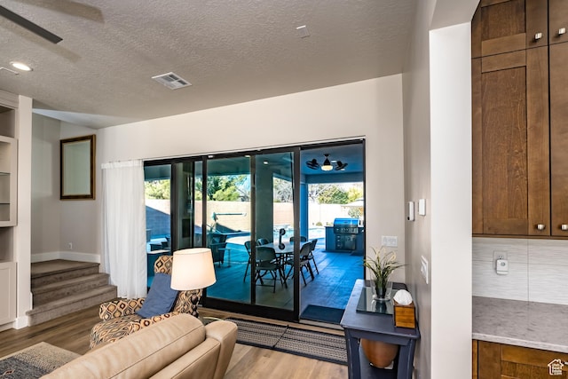 1283 N Gallen Rd W, Santa Clara, UT 84765 - living room featuring a textured ceiling, ceiling fan, and wood-type flooring